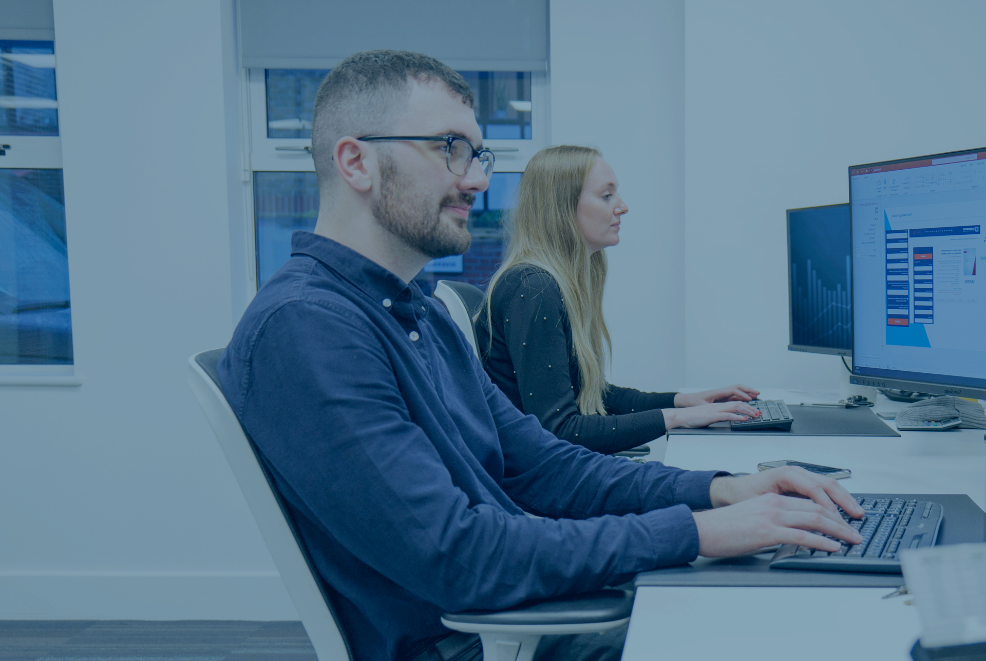 Two Headley Media colleagues working on lead generation campaigns