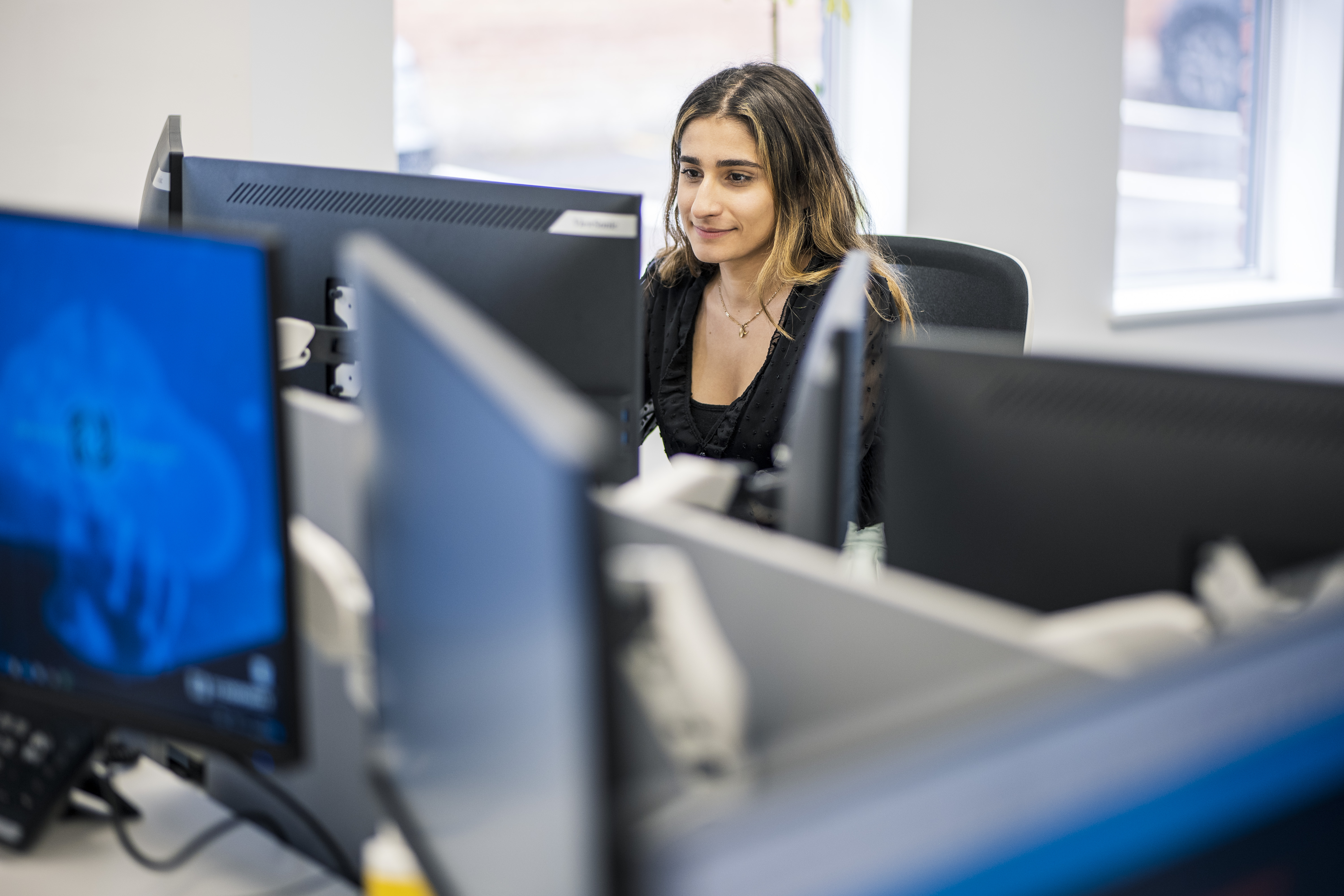 Headley Media colleague working on a B2B display advertising campaign from a desktop computer.